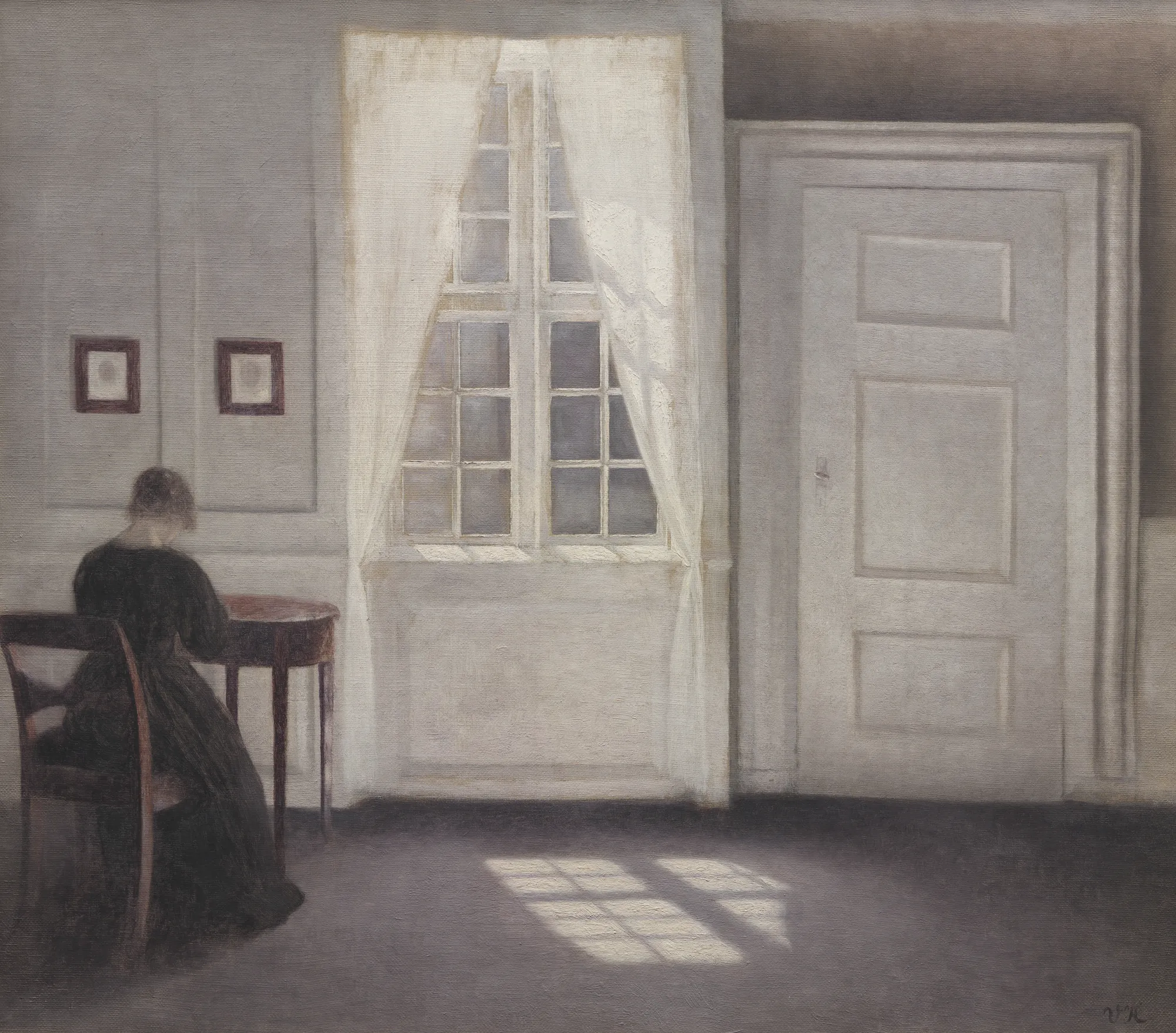 Vilhelm Hammershøi, Interior in Strandgade, Sunlight on the Floor, 1901. A woman seated at a table in a pale room.